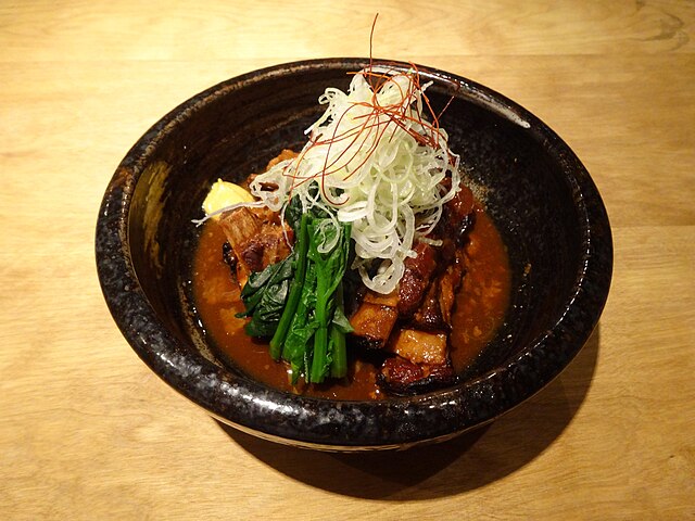 豚骨料理 (translated "Pork Bone Cuisine"): "Whispers of the Boiling Broth"