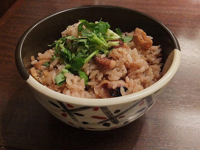 たこめし (translated "octopus rice"): "Ocean's Embrace in a Rice Bowl"