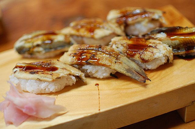 煮穴子 (translated "Stewed Conger Eel"): "Ocean's Embrace in Gentle Broth"